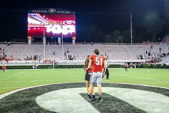 Jake's Proposal to Peyton After the Game by Blane Marable Photog