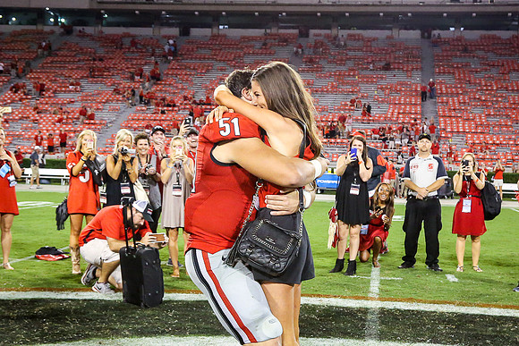 Jake's Proposal to Peyton After the Game by Blane Marable Photog