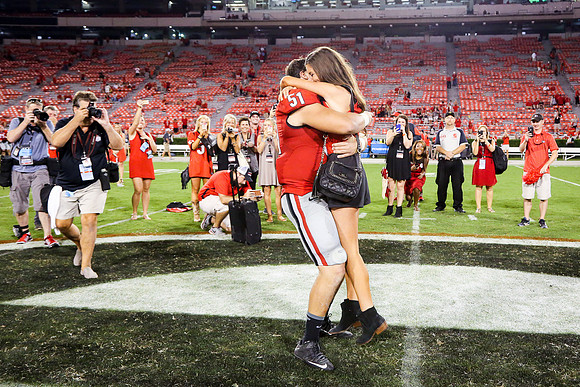 Jake's Proposal to Peyton After the Game by Blane Marable Photog