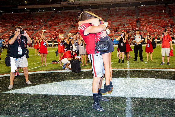 Jake's Proposal to Peyton After the Game by Blane Marable Photog