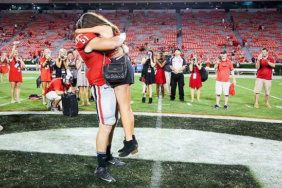 Jake's Proposal to Peyton After the Game by Blane Marable Photog