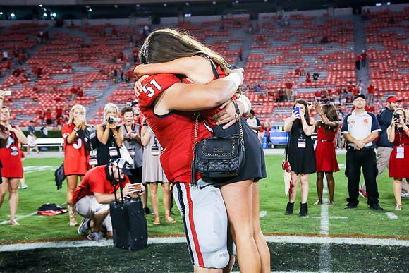 Jake's Proposal to Peyton After the Game by Blane Marable Photog
