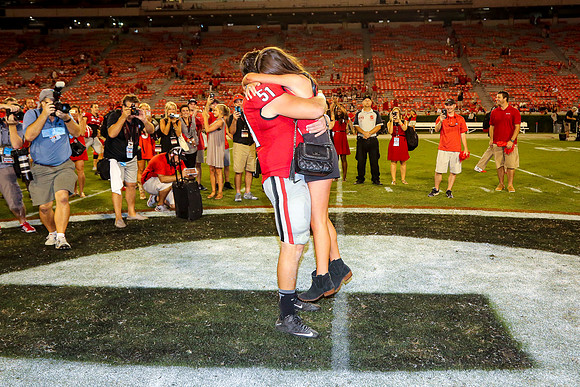 Jake's Proposal to Peyton After the Game by Blane Marable Photog