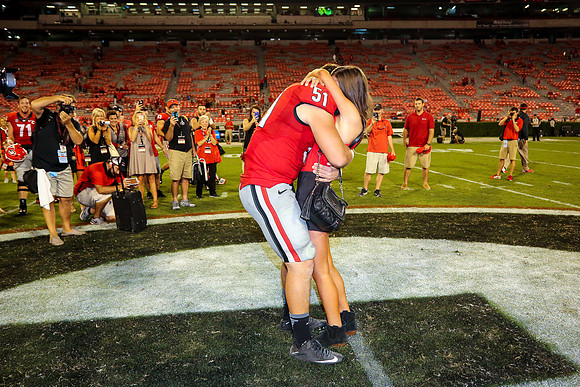 Jake's Proposal to Peyton After the Game by Blane Marable Photog