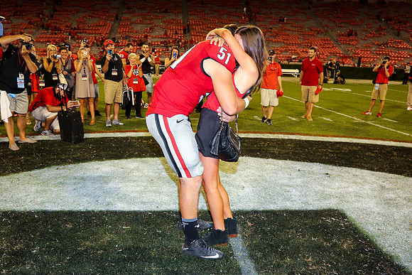 Jake's Proposal to Peyton After the Game by Blane Marable Photog