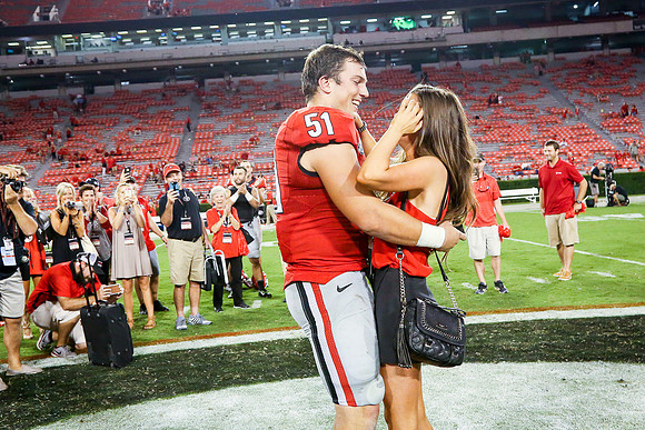 Jake's Proposal to Peyton After the Game by Blane Marable Photog