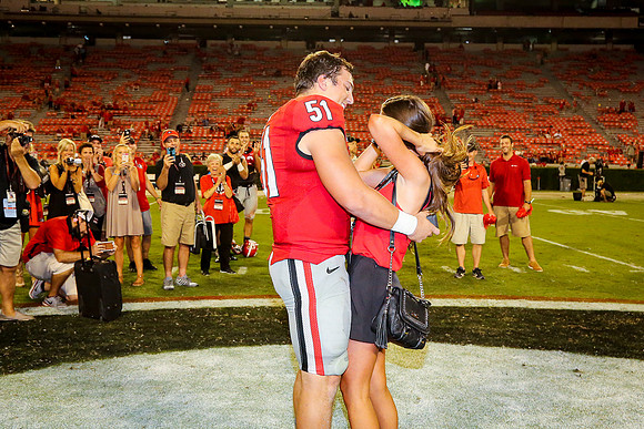 Jake's Proposal to Peyton After the Game by Blane Marable Photog