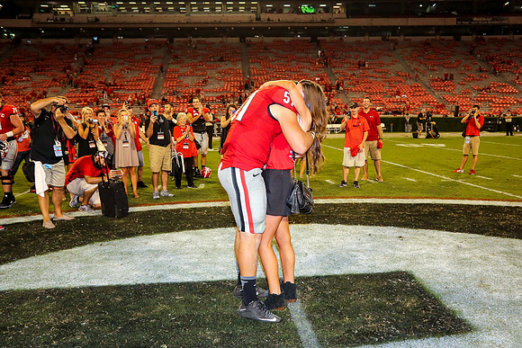 Jake's Proposal to Peyton After the Game by Blane Marable Photog