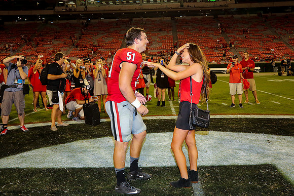 Jake's Proposal to Peyton After the Game by Blane Marable Photog