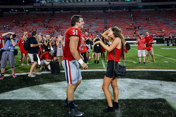 Jake's Proposal to Peyton After the Game by Blane Marable Photog