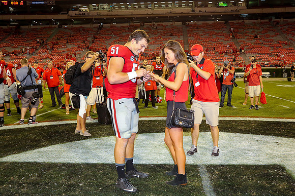 Jake's Proposal to Peyton After the Game by Blane Marable Photog