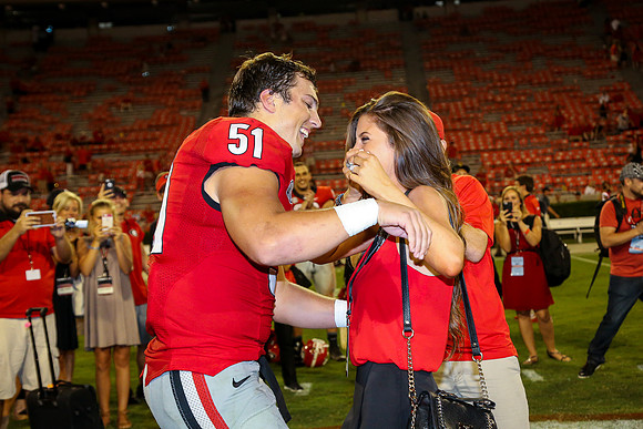 Jake's Proposal to Peyton After the Game by Blane Marable Photog