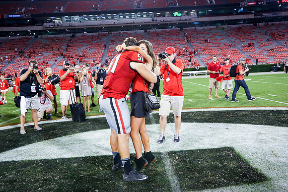 Jake's Proposal to Peyton After the Game by Blane Marable Photog