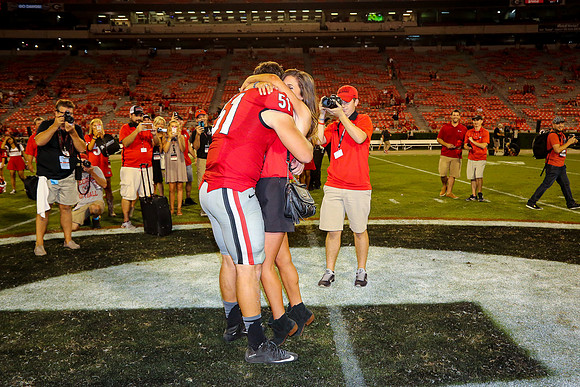 Jake's Proposal to Peyton After the Game by Blane Marable Photog