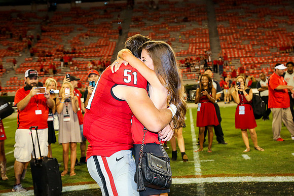 Jake's Proposal to Peyton After the Game by Blane Marable Photog