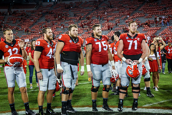 Jake's Proposal to Peyton After the Game by Blane Marable Photog
