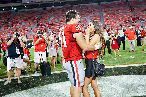 Jake's Proposal to Peyton After the Game by Blane Marable Photog