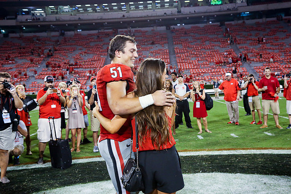Jake's Proposal to Peyton After the Game by Blane Marable Photog