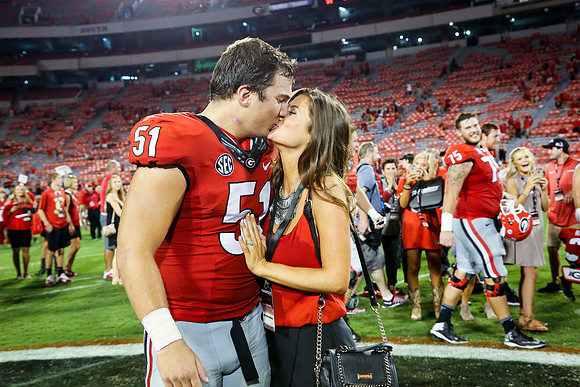 Jake's Proposal to Peyton After the Game by Blane Marable Photog