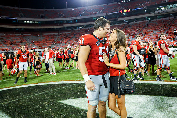Jake's Proposal to Peyton After the Game by Blane Marable Photog