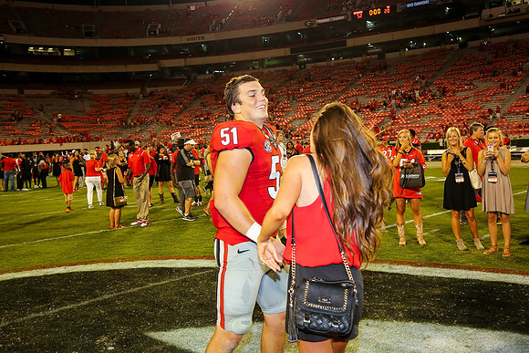 Jake's Proposal to Peyton After the Game by Blane Marable Photog