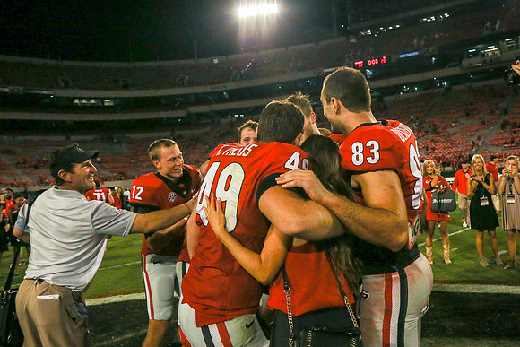 Jake's Proposal to Peyton After the Game by Blane Marable Photog