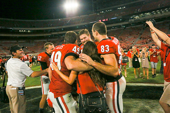 Jake's Proposal to Peyton After the Game by Blane Marable Photog
