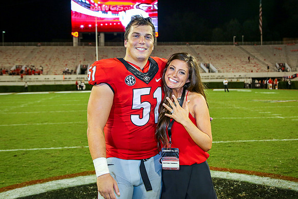 Jake's Proposal to Peyton After the Game by Blane Marable Photog