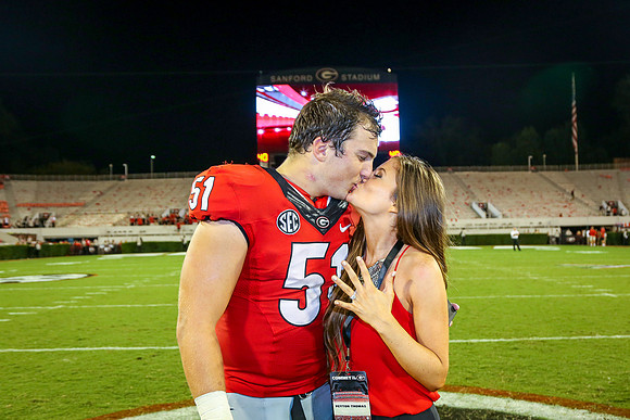 Jake's Proposal to Peyton After the Game by Blane Marable Photog
