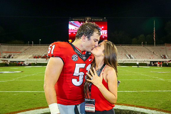 Jake's Proposal to Peyton After the Game by Blane Marable Photog