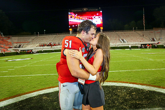 Jake's Proposal to Peyton After the Game by Blane Marable Photog