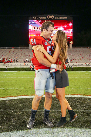 Jake's Proposal to Peyton After the Game by Blane Marable Photog