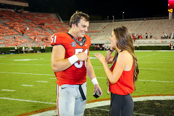 Jake's Proposal to Peyton After the Game by Blane Marable Photog