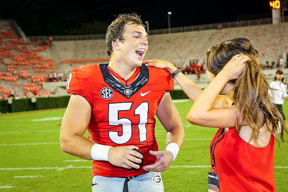 Jake's Proposal to Peyton After the Game by Blane Marable Photog