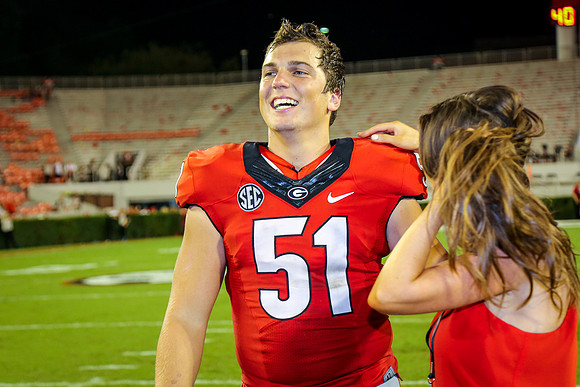 Jake's Proposal to Peyton After the Game by Blane Marable Photog