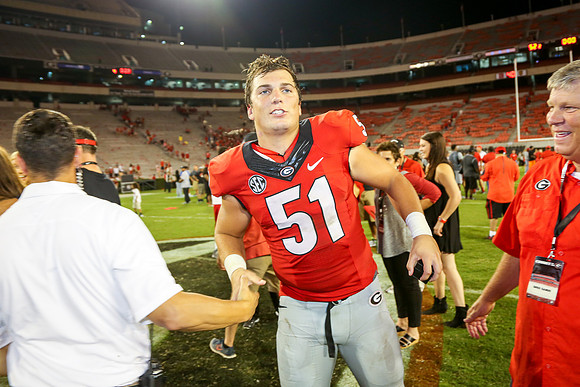 Jake's Proposal to Peyton After the Game by Blane Marable Photog
