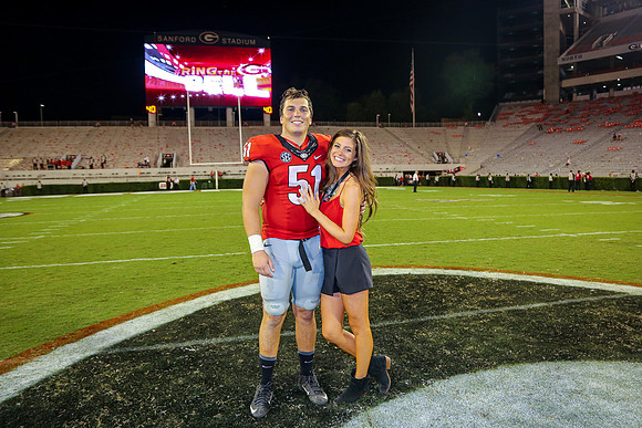 Jake's Proposal to Peyton After the Game by Blane Marable Photog