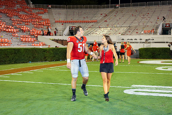 Jake's Proposal to Peyton After the Game by Blane Marable Photog