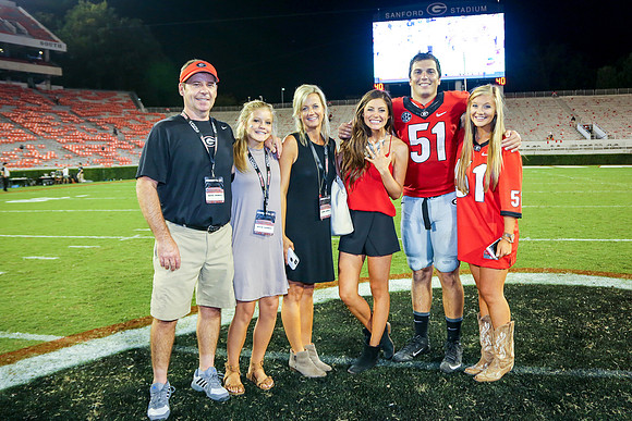 Jake's Proposal to Peyton After the Game by Blane Marable Photog