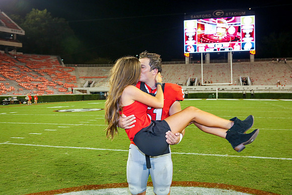 Jake's Proposal to Peyton After the Game by Blane Marable Photog