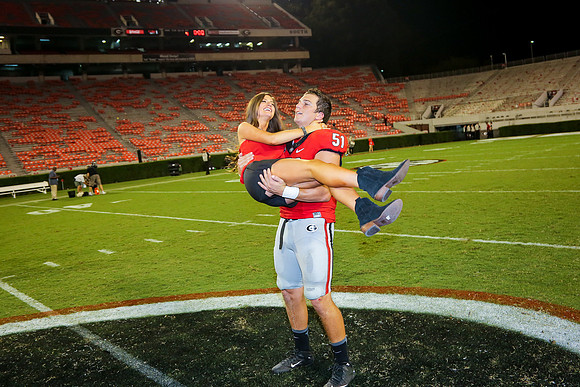 Jake's Proposal to Peyton After the Game by Blane Marable Photog