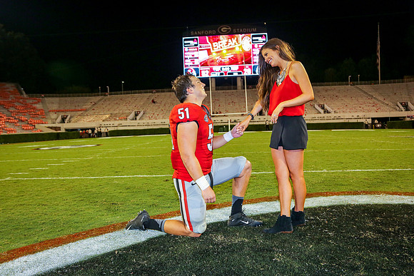 Jake's Proposal to Peyton After the Game by Blane Marable Photog