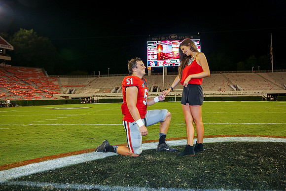 Jake's Proposal to Peyton After the Game by Blane Marable Photog