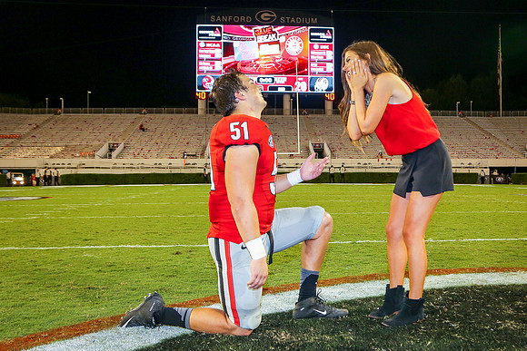 Jake's Proposal to Peyton After the Game by Blane Marable Photog