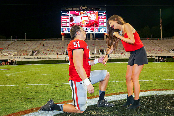 Jake's Proposal to Peyton After the Game by Blane Marable Photog